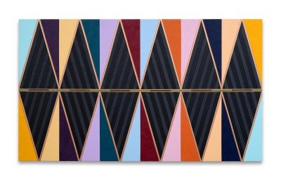 A large multicolored geometric abstract painting in black as well as shades of purple, yellow, blue, and, gold.