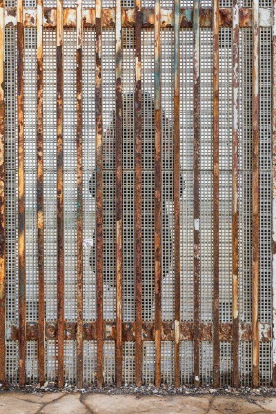 A person behind a grate.