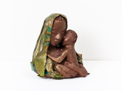 A sculpture of a Black madonna and child.