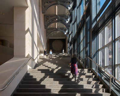 A staircase with people walking up it.